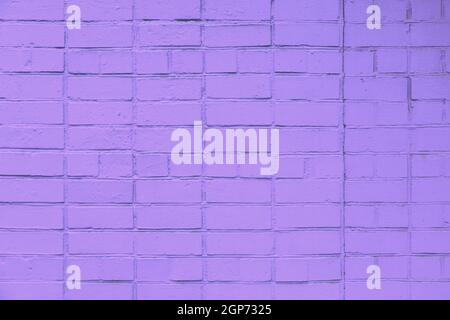 matte violet painted brick wall full frame flat background and texture Stock Photo