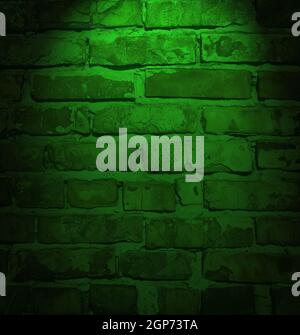 illuminated brick wall in green neon color, full frame, night Stock Photo