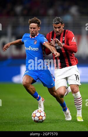 Milan, Italy. 28 September 2021. Theo Hernandez (R) of AC Milan competes for the ball with Marcos Llorente of Club Atletico de Madrid during the UEFA Champions League football match between AC Milan and Club Atletico de Madrid. Credit: Nicolò Campo/Alamy Live News Stock Photo