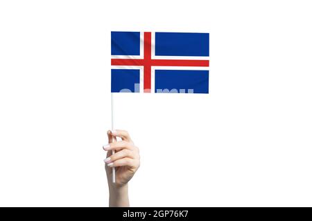 Beautiful female hand holding Iceland flag, isolated on white background. Stock Photo