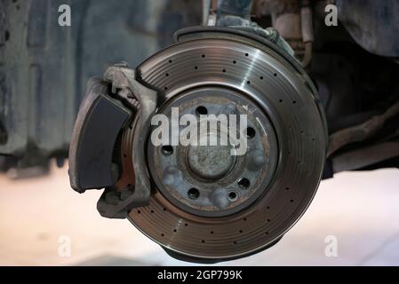 Detail of a worn disc brake ready for replacement and maintenance Stock Photo