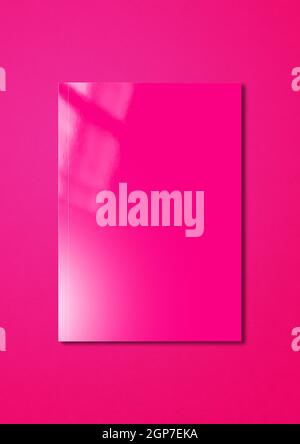 Pink booklet cover isolated on magenta background, mockup template Stock Photo