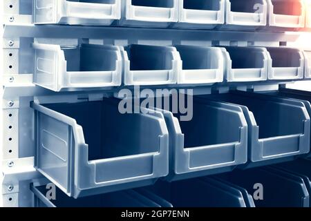 rows of multicolored plastic boxes for components Stock Photo
