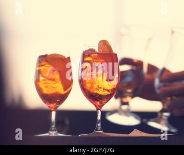 Two glasses of spritz cocktail at sunset. Stock Photo