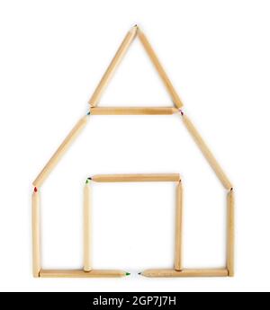 House made of wooden pencils on white background. Stock Photo