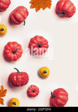 Creative pattern, autumn background. Orange pumpkins on a white background. Halloween. Stock Photo