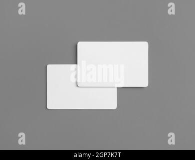 Photo of two blank business cards on gray background. Branding ID template. Flat lay. Stock Photo