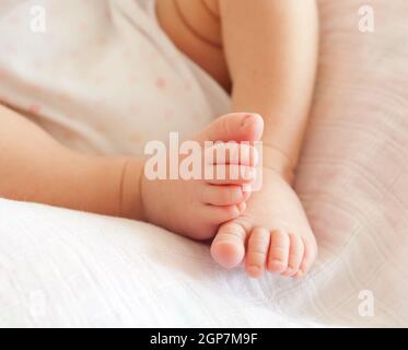 Close up of tiny baby feet. The foots of newborn. Stock Photo