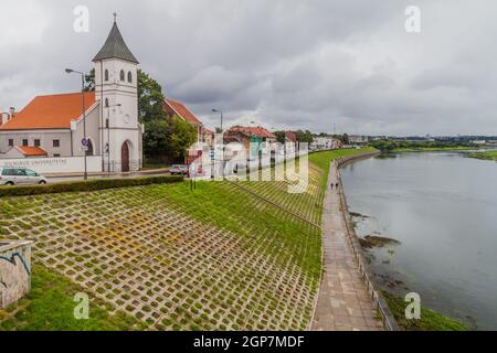 KAUNAS, LITHUANIA - AUGUST 17, 2016: River Nemunas and Evangelical Lutheran Church in Kaunas, Lithuania Stock Photo