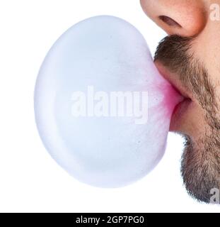 Man doing bubble with chewing gum on white background Stock Photo
