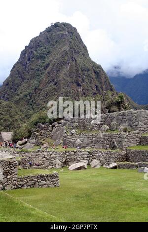 Clouds behind Machu Picchu stone ruins and nature Stock Photo - Alamy