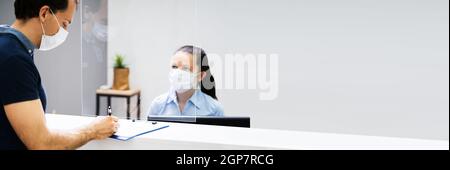 Hotel Reception Counter Or Desk With Face Mask Stock Photo