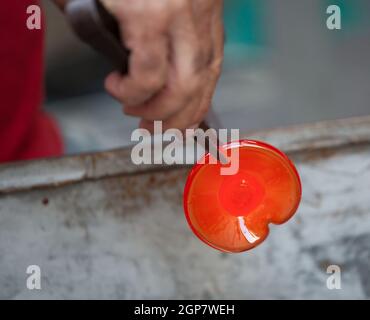 Handcrafted of glass blowing. Ancient craft for production of of glassware. Stock Photo