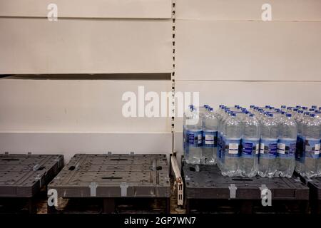 London, UK. 28th Sep, 2021. Shelves for bottled water seen almost empty in the supermarket following panic buying by the citizens in the fear of shortage.Panic buying continued in the supermarkets in the UK as there has been an ongoing HGV drivers shortage post COVID-19 pandemic and brexit. Credit: SOPA Images Limited/Alamy Live News Stock Photo