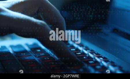 Man typing on computer keyboard with binary code overlay Stock Photo