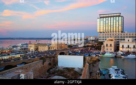 Panoramic view of Gallipoli harbour, ancient and modern buildings on the Ionian sea. Salento, Apulia, Italy Stock Photo