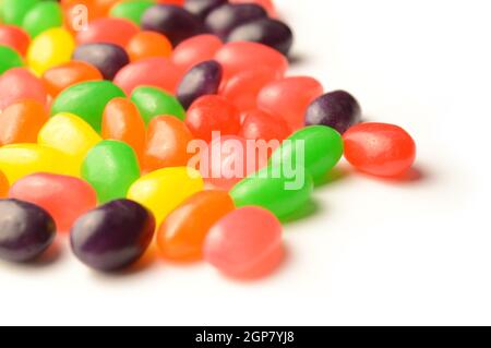 A bunch of jelly bean candy spreading from the corner of the page making an easy insert into your design pages. Stock Photo