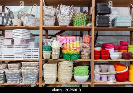 Group of empty brown pots for gardening. Baskets and pots of different color. For plants and flowers. Stock Photo