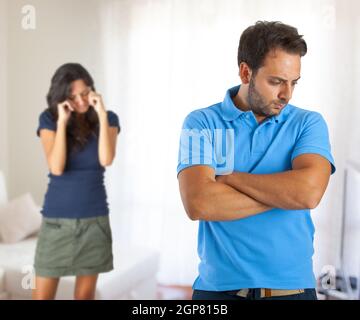 Relationship problems between husband and wife in the home. Stock Photo