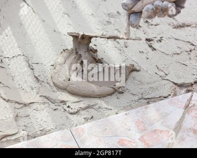 Trowel used with wooden handle and glue for flooring Stock Photo