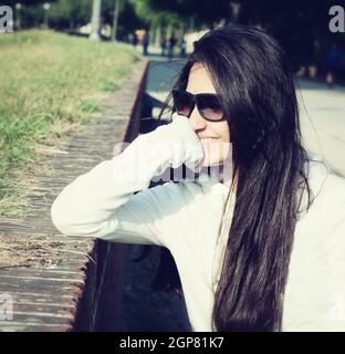 Portrait of a teenager with sunglasses photographed in backlight Stock Photo