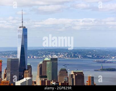 NEW YORK, NY - JULY 10, 2015: View of the Freedom Tower with on the background Upper Bay and Statue of Liberty, Manhattan, New York City. Stock Photo