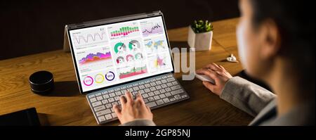 Business Woman Analyst Using KPI Data On Computer Stock Photo