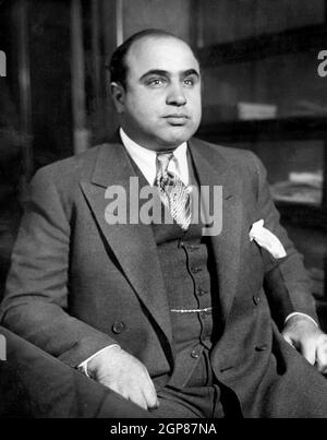 Al Capone, Alphonse Gabriel Capone (1899 – 1947) American gangster attained notoriety during the Prohibition era as the co-founder and boss of the Chicago Outfit. His seven-year reign as a crime boss ended when he went to prison at the age of 33. Al Capone is shown here at the Chicago Detective bureau following his arrest on a vagrancy charge as Public Enemy No. 1 Stock Photo