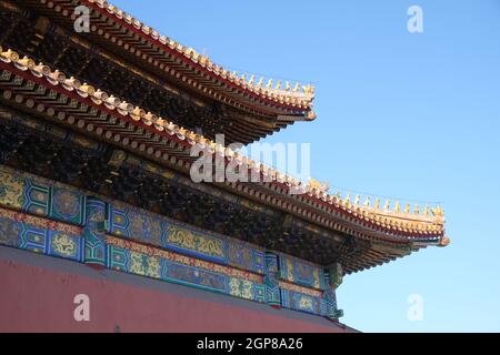 Tiled roof and facade decorated with a Chinese pattern. Palace in The Forbidden City, Beijing, China Stock Photo