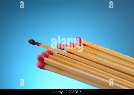The only difference is shown by contrasting a burnt matchstick. Stock Photo