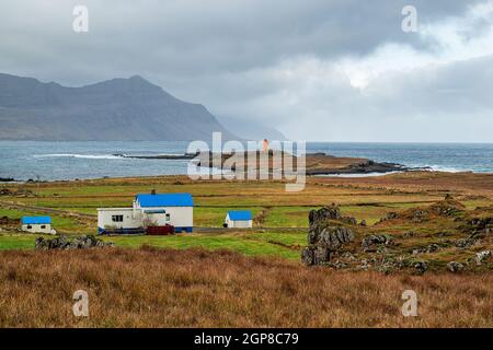 Reydarfjordur on the east side of Iceland and the lighthouse on a cloudy day Stock Photo