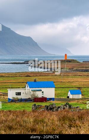 Reydarfjordur on the east side of Iceland and the lighthouse on a cloudy day Stock Photo