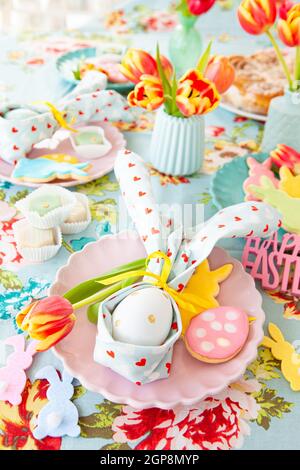 Colorful table setting with sweets for Easter Stock Photo