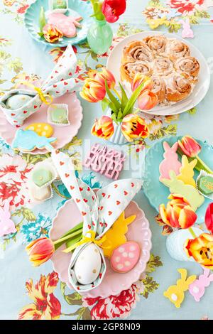 Colorful table setting with sweets for Easter Stock Photo