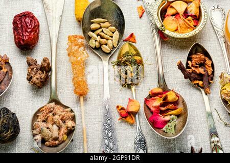 Set of dried healing herbs,plants.Dry tea leaf.Herbal medicine.Various kinds of tea in spoons Stock Photo