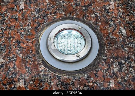 LED backlight in granite stone. Light fixture. Stock Photo