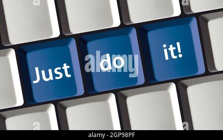 Call to action - close up of a keyboard with the words just to it on blue buttons - concept motivation Stock Photo