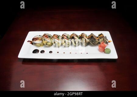 Traditional and authentic Japanese cusine know as a crunchy Sushi Roll Stock Photo