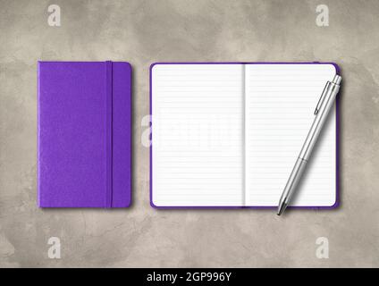 Purple closed and open lined notebooks with a pen . Mockup isolated on concrete background Stock Photo