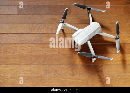 small drone copter on a wooden background Stock Photo