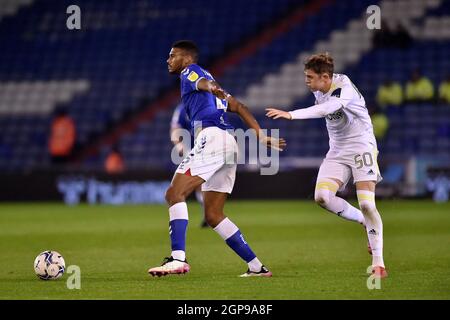 OLDHAM, UK. SEPT 28TH Oldham Athletic's Kyle Jameson tussles with Max Dean of Leeds United during the EFL Trophy match between Oldham Athletic and Leeds United at Boundary Park, Oldham on Tuesday 28th September 2021. (Credit: Eddie Garvey | MI News) Credit: MI News & Sport /Alamy Live News Stock Photo