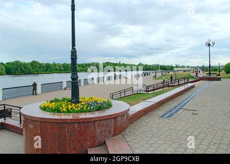 Modern Sozh embankment in Gomel. People have a rest in city near river. Beautiful panorama to Sozh river in Belorussian city Gomel Stock Photo