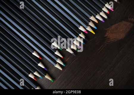 Color pencils for drawing on wooden background. Top view. Flat lay. Stock Photo