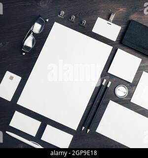 Photo of blank stationery set on wooden background. Corporate identity mockup. Responsive design template. Top view. Flat lay. Stock Photo