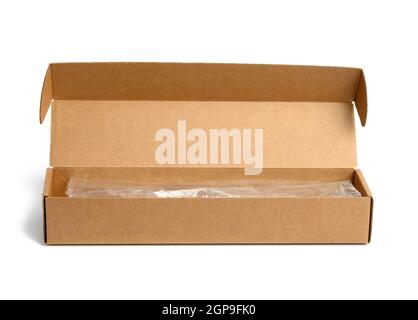narrow rectangular open cardboard box isolated on white background, close up Stock Photo