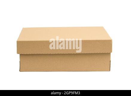 closed cardboard rectangular box made of corrugated brown paper isolated on a white background Stock Photo