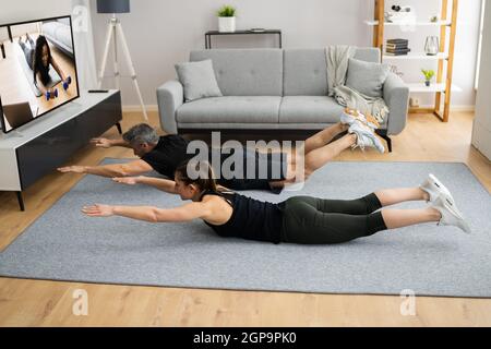 Online TV Home Fitness Workout And Exercise Stock Photo
