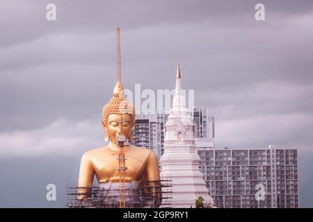 June 2020 Bangkok Thailand Giant golden Buddha under construction change skyline in Bangkok at Wat Paknam temple in Phasi Charoen district of Bangkok. Stock Photo