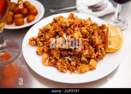 Spanish seafood dish battered fried baby squid Stock Photo