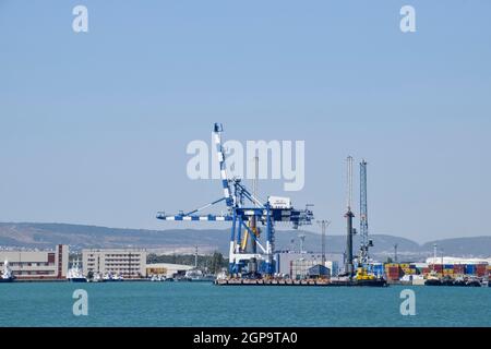 Novorossiysk, Russia - September 9, 2016: international seaports. Cargo port with port cranes. Sea bay and mountainous coast. Stock Photo
